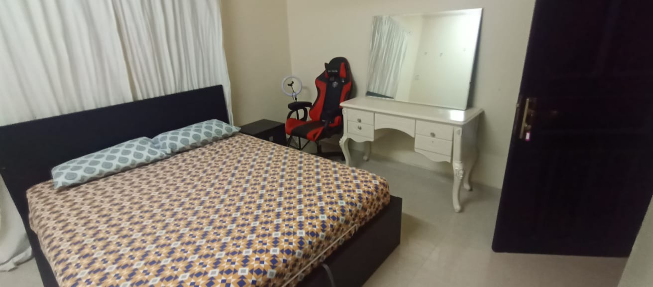 Ikea hydraulic king size bed with Ikea stylish cupboard and side table