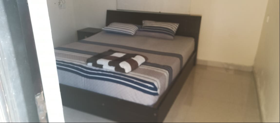 Wooden double bed with dresser